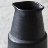 porcelain jug with black brown reactive glaze 