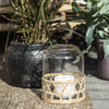 glass bell jar lantern or vase with woven straw cover