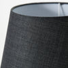 grey sculptural cement table lamp with linen shade