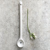long porcelain spoon with heart design