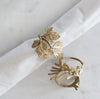 set of six napkin rings brass leaf design