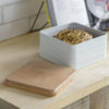 white metal cake tin with wooden lid stackable