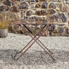 Solid distressed iron folding outdoor table