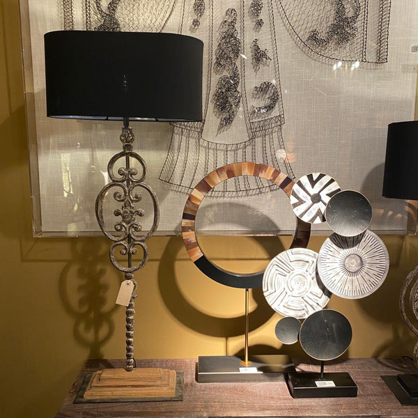 Tall iron scroll lamp with black shade