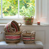 Set of Four round storage baskets natural and rose