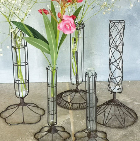 Set of three wire and glass stem vases