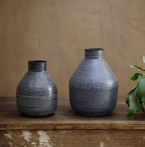matt black metal vase with imprinted detail
