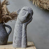 Abstract head in hand sculpture cement