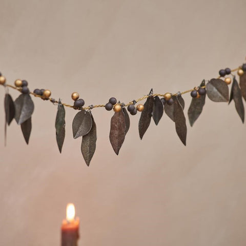 Decorative antiqued brass leaves and berries garland